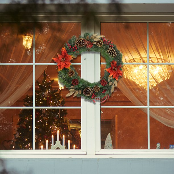 Artisasset A Christmas Wreath Decorated With Red Flowers And Pine Nuts