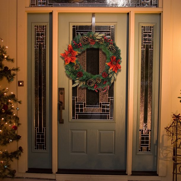 Artisasset A Christmas Wreath Decorated With Red Flowers And Pine Nuts